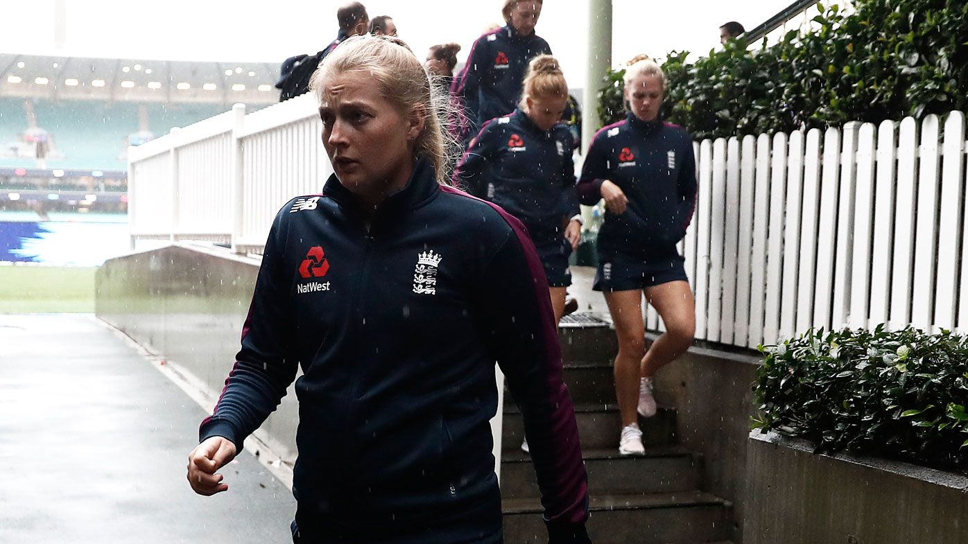  Sophie Ecclestone of England leaves the ground after the match was abandoned due to rain 