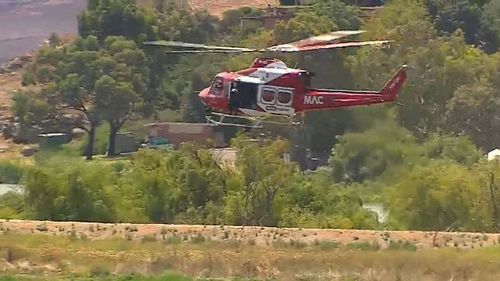 A police helicopter attempts to 'flush out' Kirchner. (9NEWS)