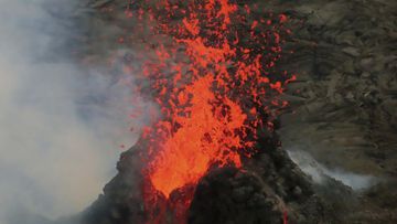 Lava erupts within the summit crater of Kilauea Volcano in Hawaii Volcanoes National Park on Hawaiis Big Island. 
