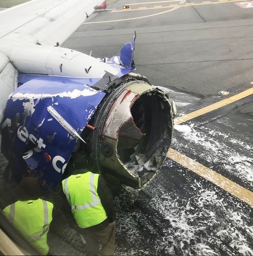 The mangled engine of the plane on the tarmac at Philadelphia. Picture: AP