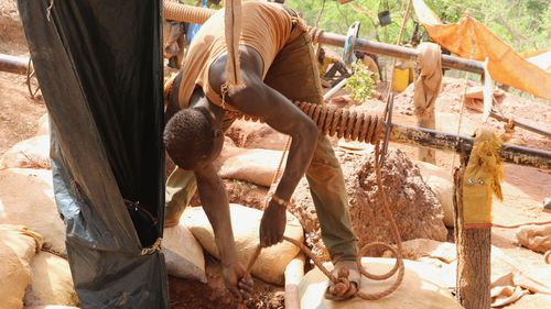 A gold miner pulls a rope from a mining shaft near Hounde, some 100kms northeast of Burkina Faso's town of Bobo-Dioulasso.