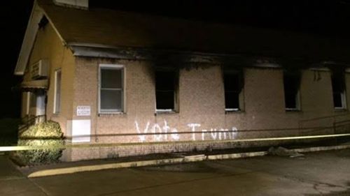 Black church is torched in US south, vandalised with Trump slogan