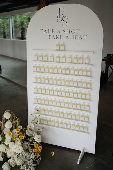 diy shot wall wedding seating chart