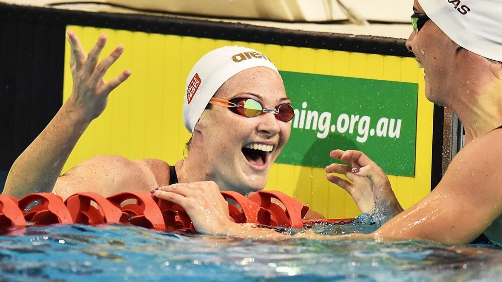 Cate Campbell reacts alongside her sister Bronte after their semi final. (Getty)