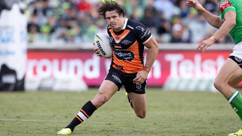 James Roberts on the attack for Wests Tigers.