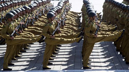 North Korean soldiers goosestep during a parade in Pyongyang.