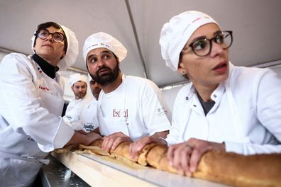 Eighteen French bakers took part in beating the world record for the longest baguette during the Suresnes Baguette Show in Suresnes, France, on Sunday.