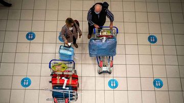 Travellers wait to board a flight at Johannesburg&#x27;s International Airport in South Africa.