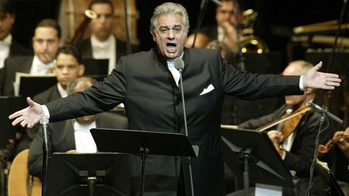 FILE - In this Thursday, Jan. 22, 2004, file photo, Placido Domingo sings during his performance at the National Theater in Santiago, Dominican Republic. 