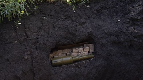 Ammunition is stored in a Ukrainian trench near the frontline in Donetsk region, eastern Ukraine, Wednesday, June 8, 2022. (AP Photo/Bernat Armangue)