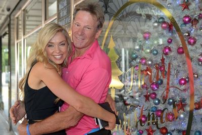 Sam Newman has Chrissie cuddles with <i>Postcards</i> presenter and model Brodie Harper.