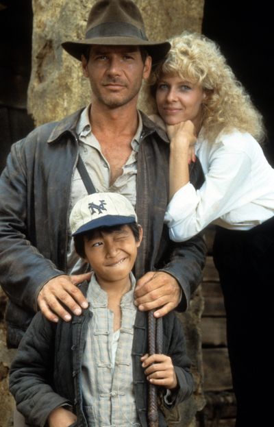 Harrison Ford, Jonathan Ke Quan and Kate Capshaw on set of the film 'Indiana Jones And The Temple Of Doom', 1984. 