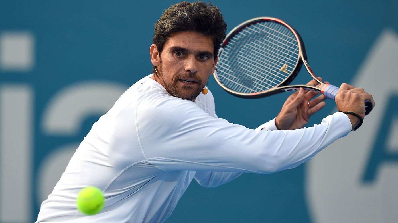 Mark Philippoussis plays a backhand.