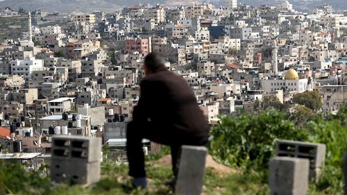 A man looks over the Nur al-Shams Refugee Camp, east of Tulkarm city in the occupied West Bank in March.