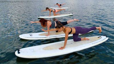 Swap yoga for stand-up paddleboarding yoga
