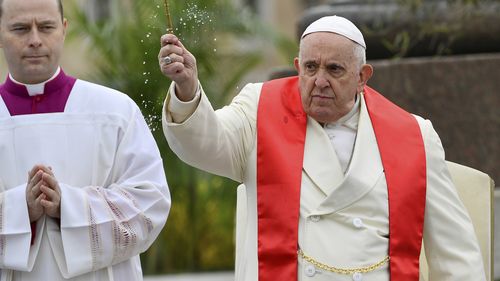 Pope Francis blesses faithful with olive and palm branches before celebrating the Palm Sunday's mass in St. Peter's Square at The Vatican Sunday, April 2, 2023 