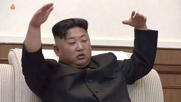 Kim Jong-un smokes a cigarette