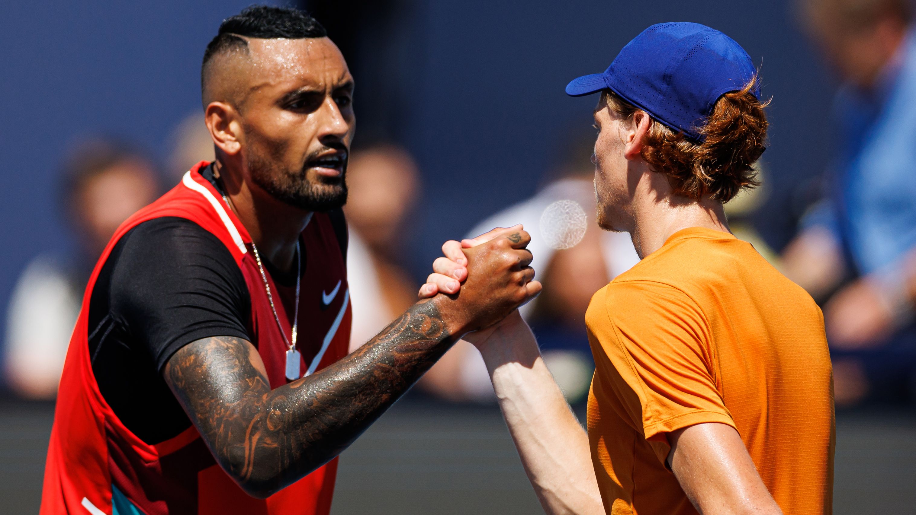 Jannik Sinner and Nick Kyrgios of Australia after their match at the Miami Open in 2022.