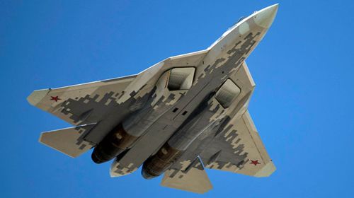 A Russian air force fighter jet roars overhead the parade. (AP).