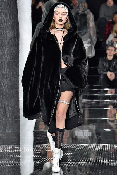 Once the preserve of mischief-making hoodlums everywhere, the hood has experienced a decidedly haute reanimation
in the world of high fashion. It made an appearance at Vetements, often with high, sculpted
shoulders; at Riri’s Fenty x Puma show in the form of plush, furry coats and on the runway at Public School and Rag &amp; Bone.&nbsp;