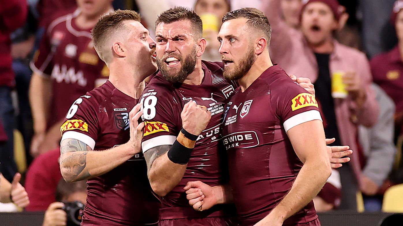 Kurt Capewell celebrates scoring a try with teammates