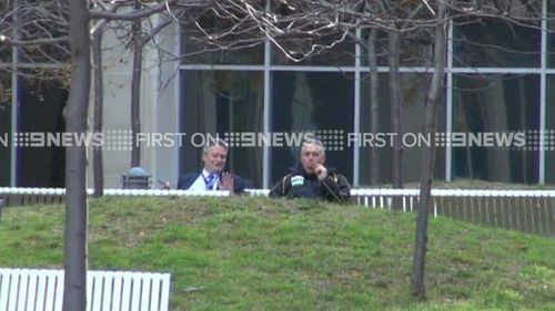 Joe Hockey and Mathias Corrmann enjoy a cigar outside The Treasury.