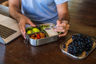 Man eating as he works from home