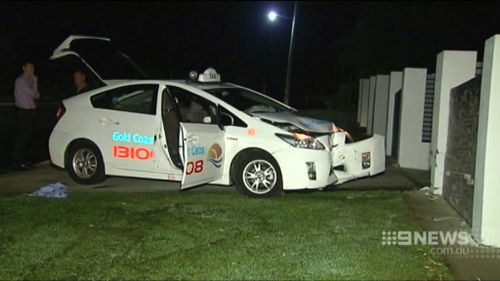 The taxi driver attempted to flee the attacker but crashed into a wall. (9NEWS)