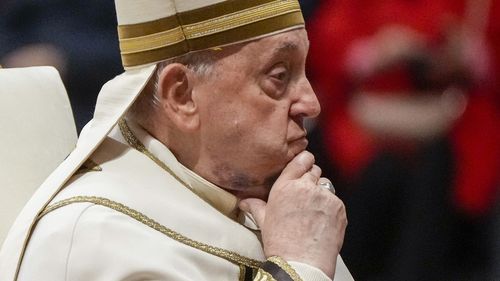 FILE - Pope Francis reacts during a solemn mass where he made 21 new cardinals in St. Peter's Basilica at The Vatican, Saturday, Dec. 7, 2024. (AP Photo/Gregorio Borgia, File)