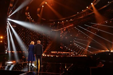 King Charles III and Camilla, Queen Consort stand on the stage after switching on stage lighting as they visit the host venue of this year's Eurovision Song Contest, the M&S Bank Arena in Liverpool on April 26, 2023 in Liverpool