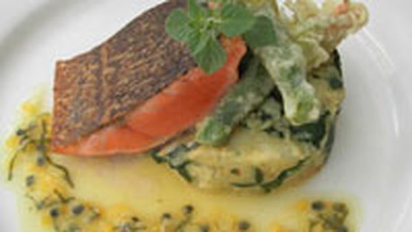 Grilled Atlantic salmon on crushed kipfler potatoes, tempura zucchini flower, wilted spinach 		