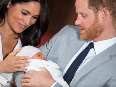 The Duke and Duchess of Sussex with their baby son, who was born on Monday morning, during a photocall in St George's Hall at Windsor Castle.