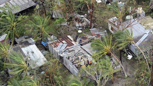 A damaged house near the Queensland town of Forrest Beach after Cyclone Yasi in 2011. 