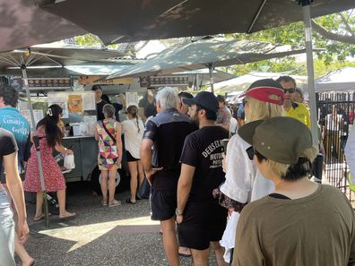 People lining up at a food truck at Parap Market in Darwin