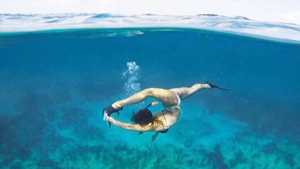 Royal Caribbean gymnast Sydney Brown travels the world, taking enviable Instagram shots.