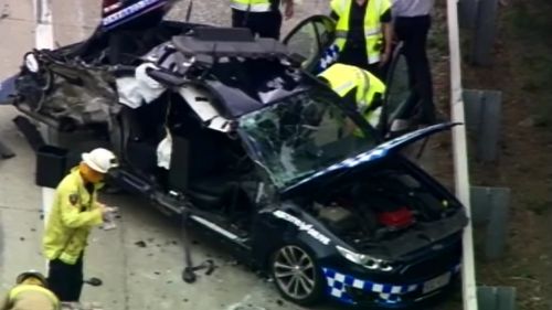 A truck and police car crashed on the Pacific Motorway. (9NEWS)