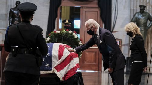 Joe Biden bids farewell to John Lewis at a memorial at the US Capitol.