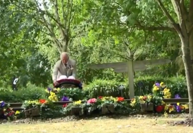 Prince Charles lays a wreath.