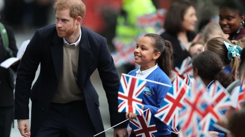 Sophia was waving a British flag when Prince Harry approached her. (PA/AAP)