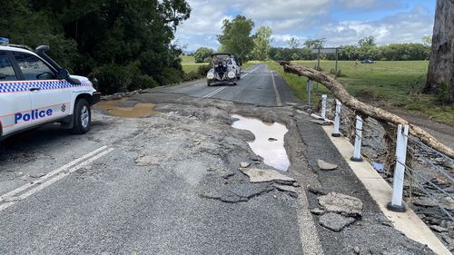 A cracked road is seen in Gympie, in south-east Queensland. Cedar Pocket Road has been subject to extreme rain and flash flooding.
