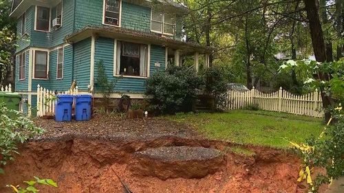 A sinkhole located on private property along in Asheville, North Carolina continues to grow.