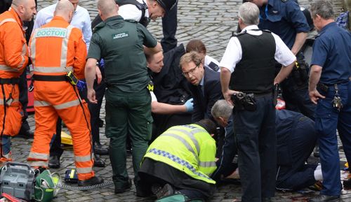 MP Tobias Ellwood tried to resuscitate PC Palmer. (AP/AAP)