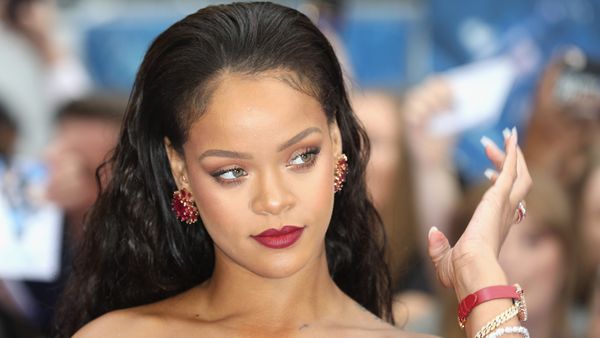 Rihanna Struggles With Her Boobs Popped Out In Low-cut Scarlet