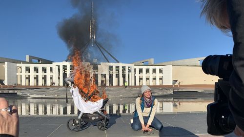 A climate protest has ramped up outside Parliament House following a climate change report.