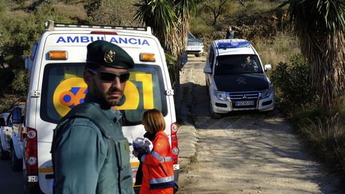 Emergency services remain at the scene where the boy remains trapped.