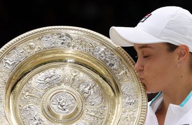 Ashleigh Barty celebrates winning Wimbledon with Venus Rosewater Dish trophy