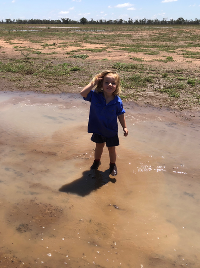 Cullen's niece Charlotte also jumped at the chance to play in the rain.