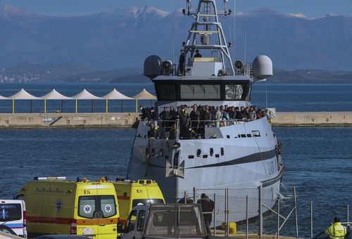 The Italian customs inspection vessel Monte Sperone carrying passengers evacuated from a ferry arrives at the port of Corfu island, northwestern Greece, Friday, Feb. 18, 2022.