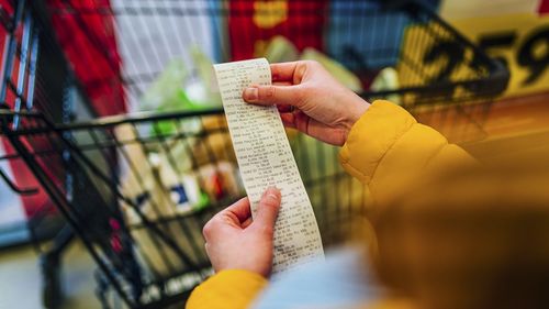 paying for groceries at the supermarket