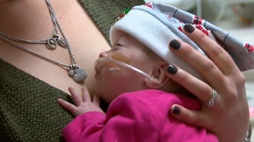 Leanne Myers, who has sewn a total of 60 hats for the babies, said the small gifts are as much for the parents as their newborns. (9NEWS)